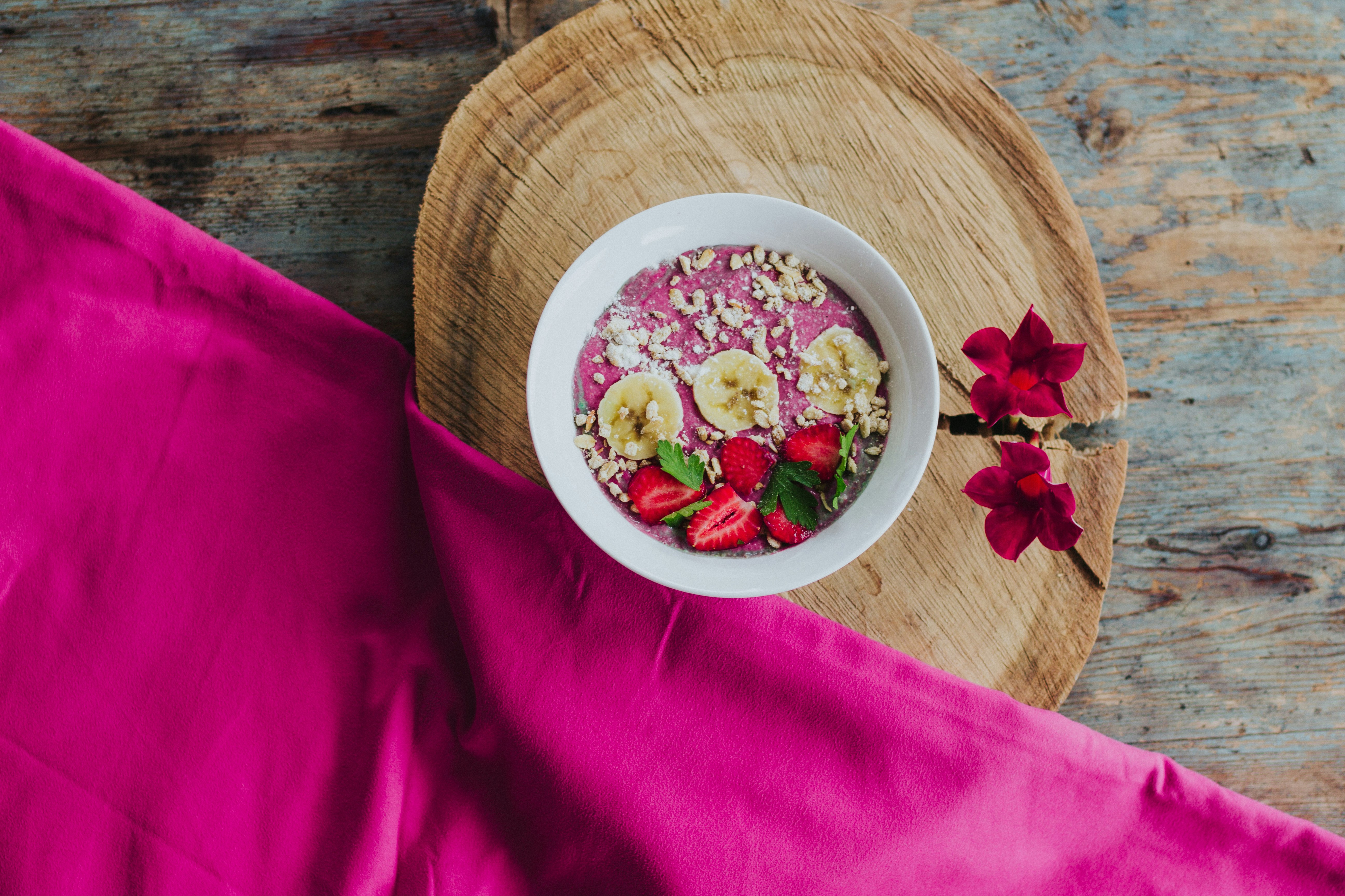 strawberry and banana slices on bowl